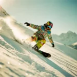 Snowboard instructeur demonstreert stuurstechniek in poedersneeuw met gebogen knieën en gebalanceerde houding op bergpiste